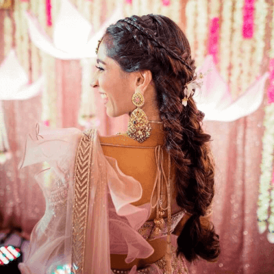 Photo of Poufed braided bun for sangeet or reception | Hairstyles for gowns,  Lehenga hairstyles, Indian wedding hairstyles
